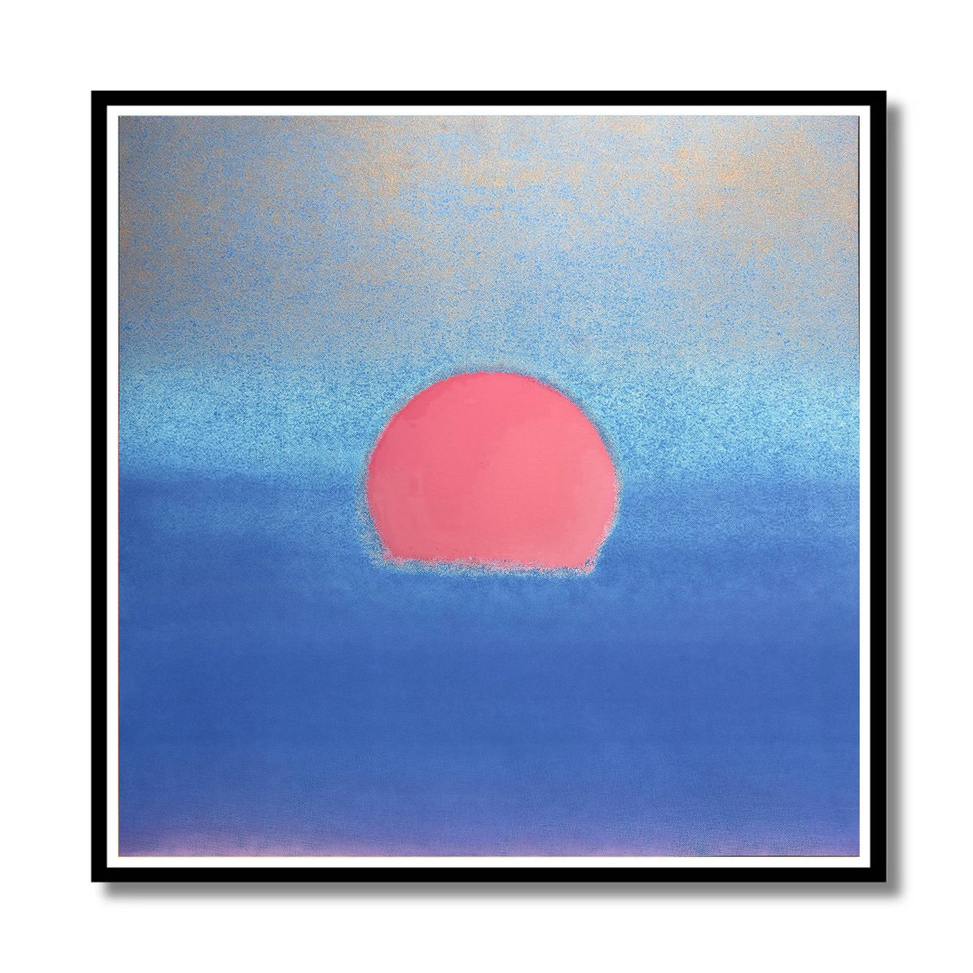 A square framed pastel artwork featuring a pink sun over a blue ocean, with a black frame and white mat on a white background.