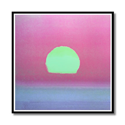 A square framed art print featuring a minimalist sunset design with a bright lime green sun over a pink sky and a soft blue horizon, presented on a white background with a black frame.
