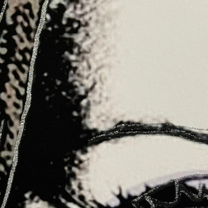 Close-up of a textured surface with patterns and a circular design.