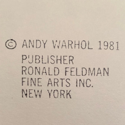Text attribution to Andy Warhol, publisher Ronald Feldman, and Fine Arts Inc. on a beige background