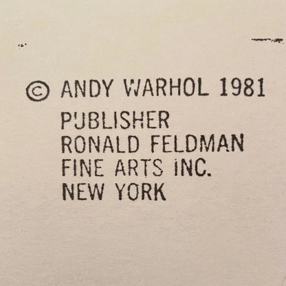 Text attribution to Andy Warhol and Ronald Feldman Fine Arts Inc. on a beige background