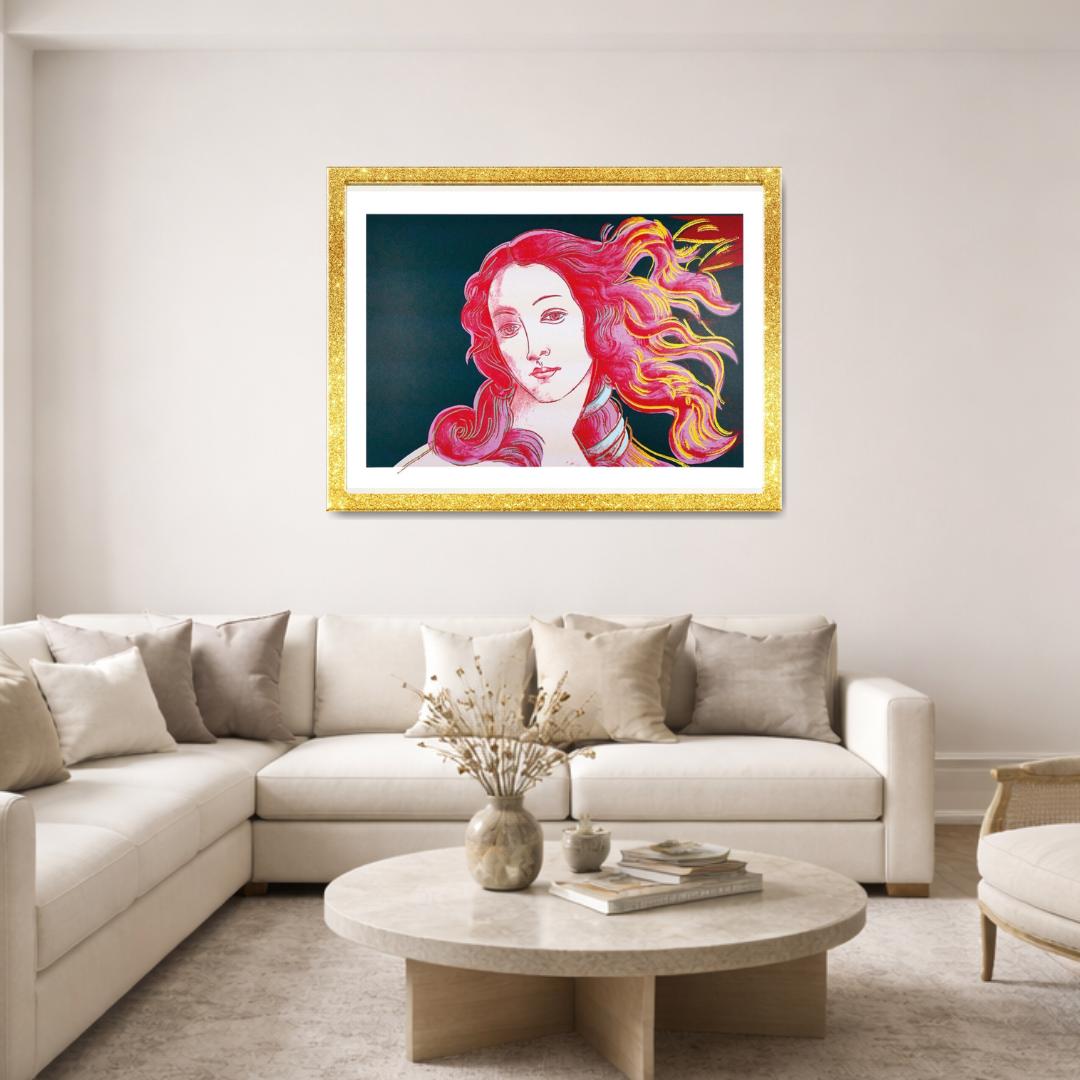 Living room with a beige sectional sofa, round coffee table, and a colorful painting of a woman with red hair on the wall.