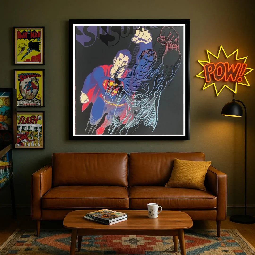 Living room with a brown leather sofa, coffee table, and superhero artwork on the wall.