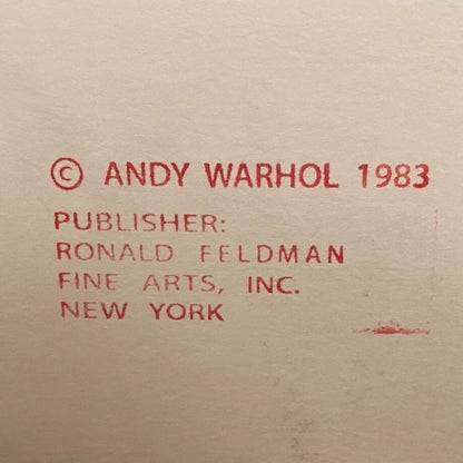 Red text on a beige background indicating Andy Warhol copyright and publisher information.