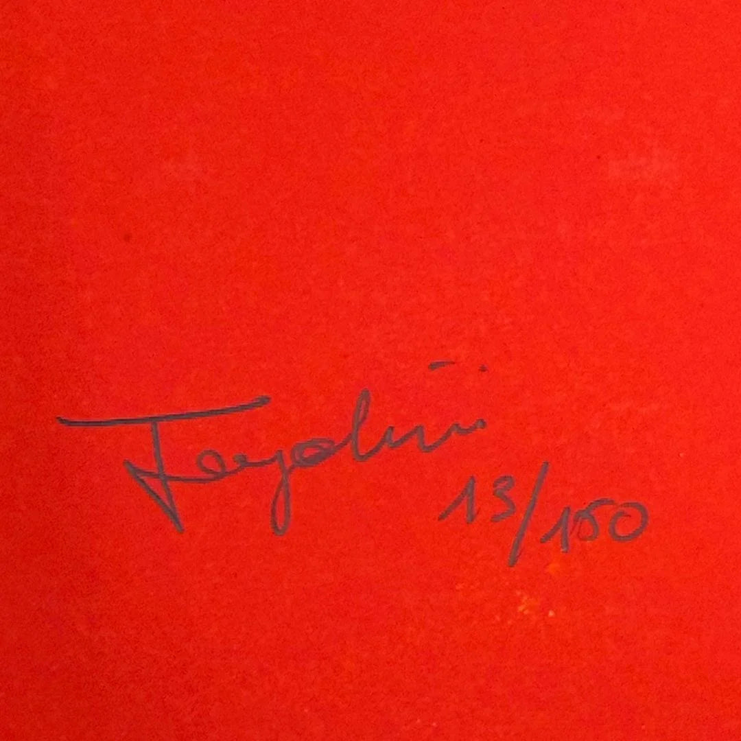 Signature on a red background with '13/150' indicating a limited edition.