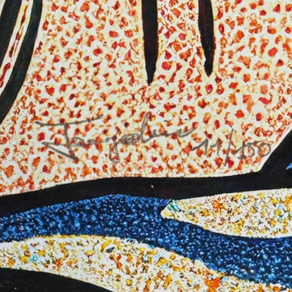 Close-up of a textured surface with a signature and a numbered edition in the center.