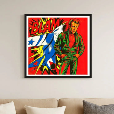 Framed artwork with a colorful design featuring a character and the word 'BLAM' on a red background, displayed on a wall above a sofa.