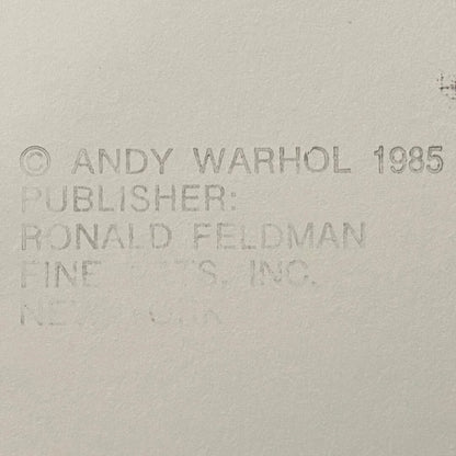Text attribution to Andy Warhol and Ronald Feldman Fine Arts Inc. on a beige background