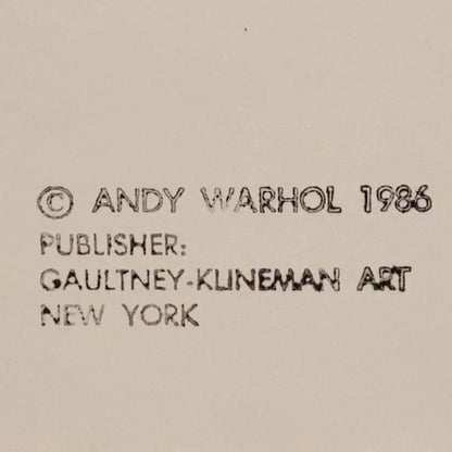 Text attribution to Andy Warhol with a publisher name on a beige background