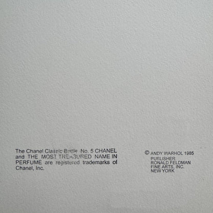 Gray background with black text and a copyright notice for Chanel and Andy Warhol.