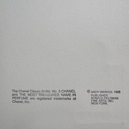 Gray background with black text crediting Chanel and Andy Warhol.